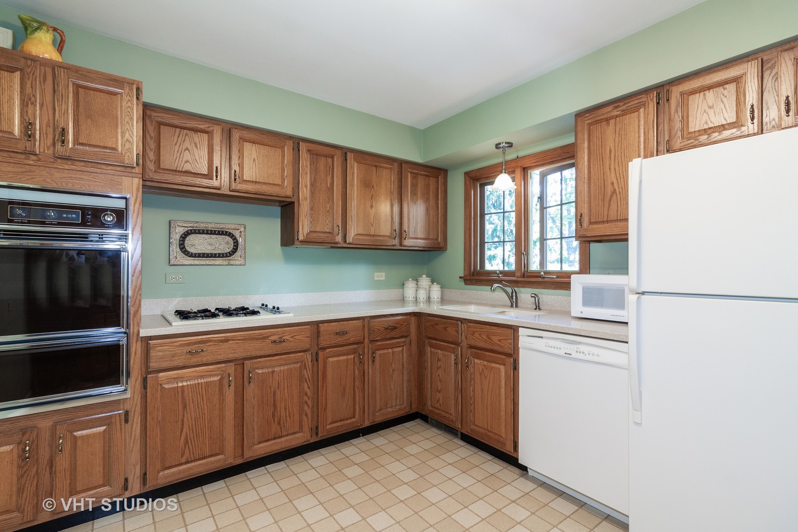 N255 Peter Road Winfield, IL 60190 - Photo 6 of 29 a kitchen with stainless steel appliances granite countertop a refrigerator a sink dishwasher a stove with wooden cabinets and floor