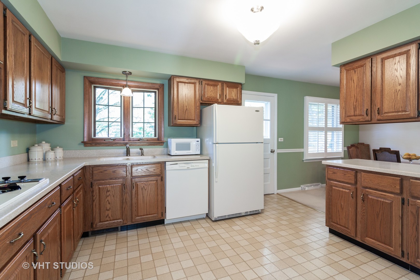 N255 Peter Road Winfield, IL 60190 - Photo 7 of 29 a kitchen with a refrigerator sink and cabinets