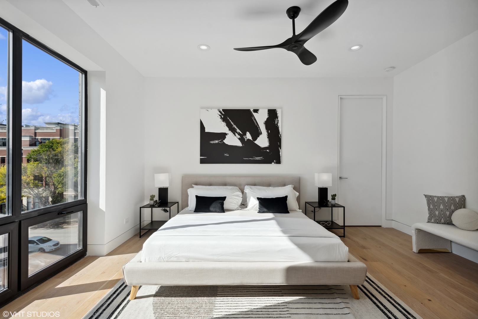 Undisclosed Address Chicago, IL 60657 - Photo 13 of 39 a bedroom with a large bed and a window