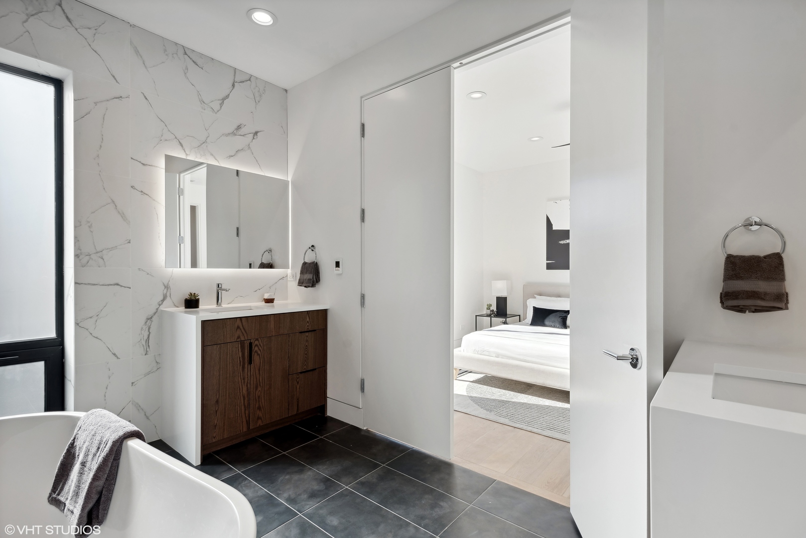 Undisclosed Address Chicago, IL 60657 - Photo 16 of 39 a bathroom with a sink and a mirror