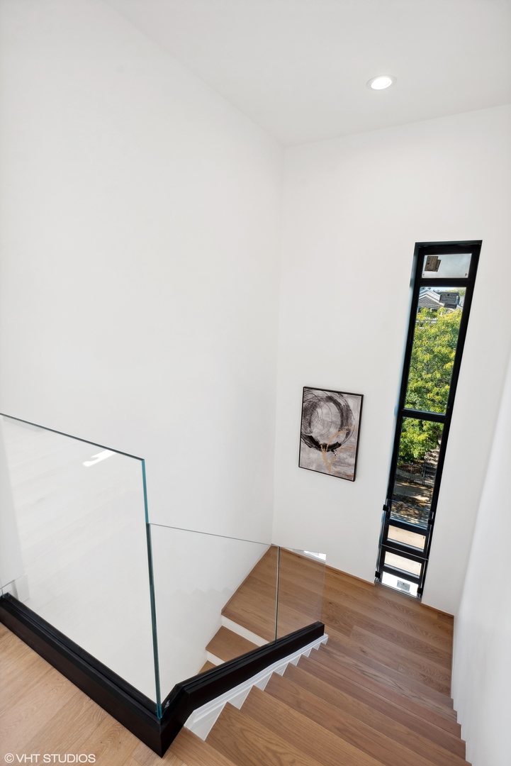 Undisclosed Address Chicago, IL 60657 - Photo 21 of 39 a room with a bed and a book shelf