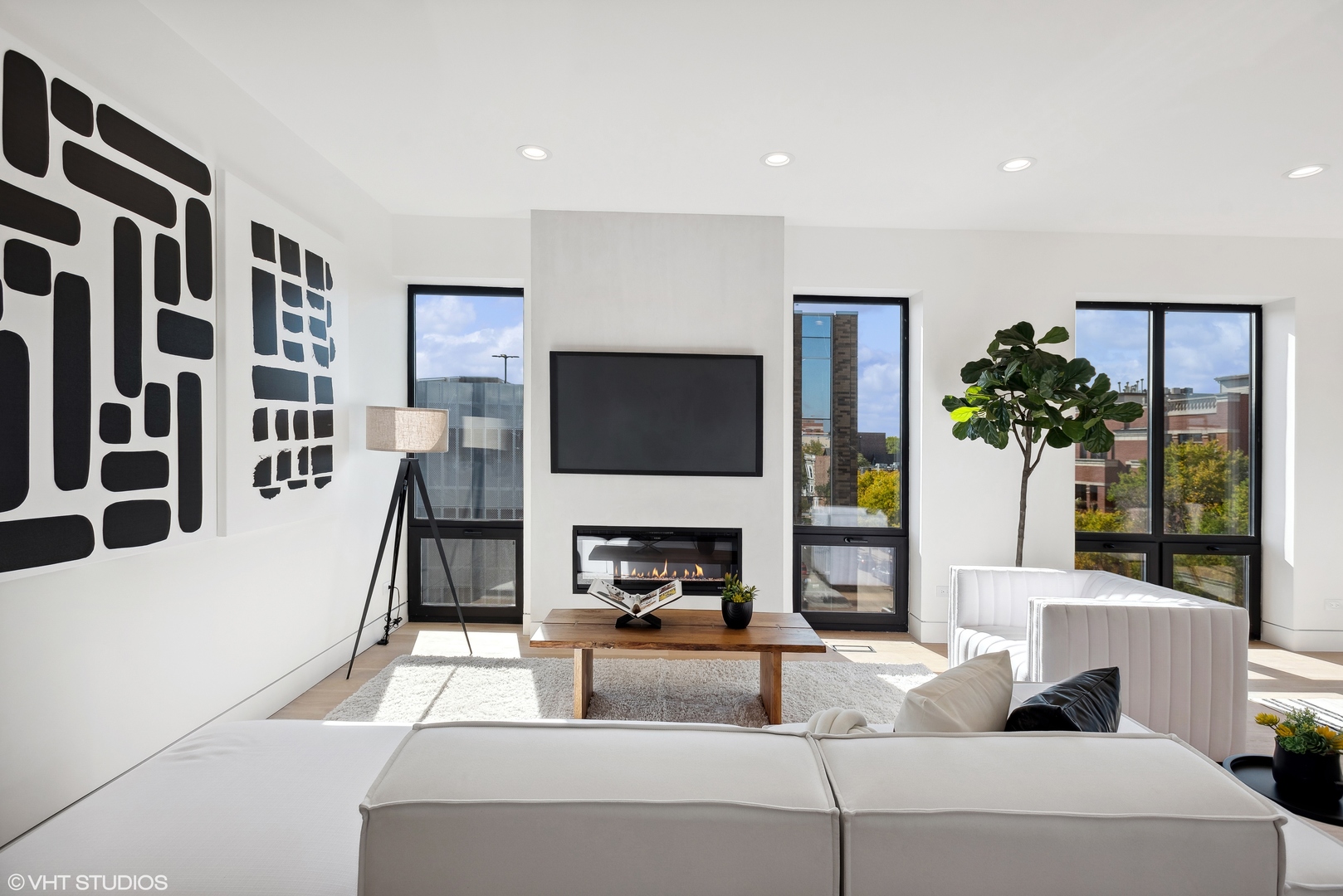 Undisclosed Address Chicago, IL 60657 - Photo 25 of 39 a living room with furniture a flat screen tv and a fireplace