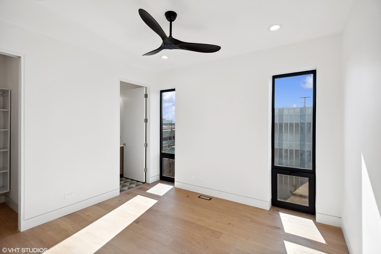 Undisclosed Address Chicago, IL 60657 - Photo 30 of 39 wooden floor in an empty room with a window