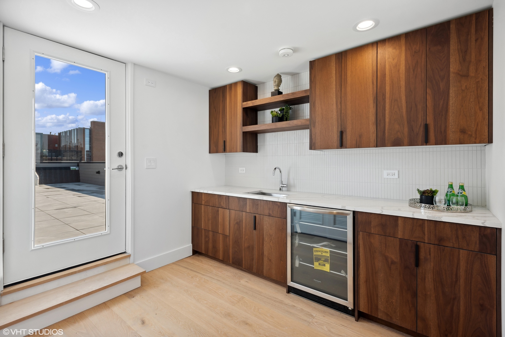 Undisclosed Address Chicago, IL 60657 - Photo 33 of 39 a kitchen with stainless steel appliances granite countertop a sink and cabinets with wooden floor
