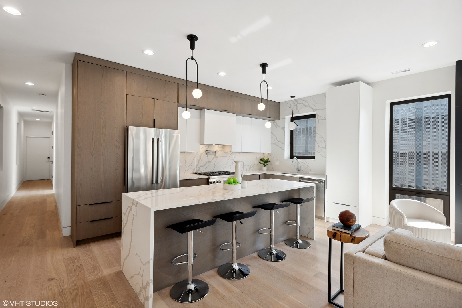 Undisclosed Address Chicago, IL 60657 - Photo 5 of 39 a kitchen with stainless steel appliances kitchen island granite countertop a table chairs refrigerator and microwave