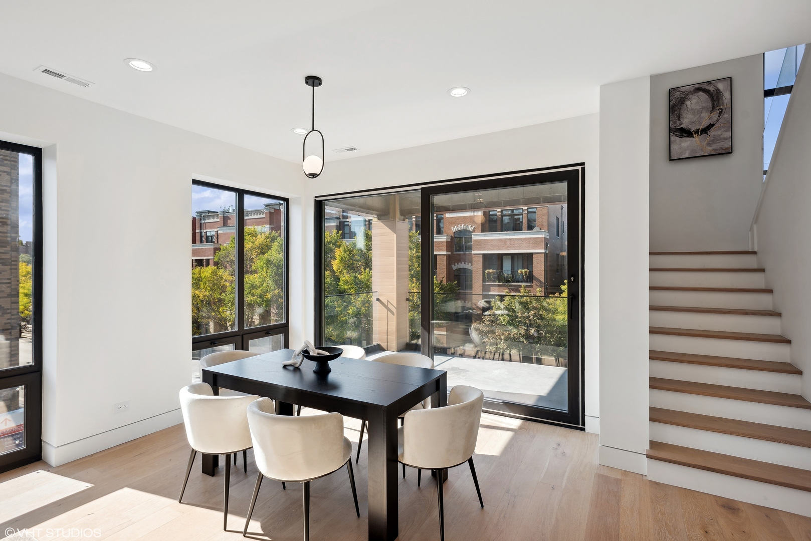 Undisclosed Address Chicago, IL 60657 - Photo 9 of 39 a view of a dining room with furniture window and wooden floor