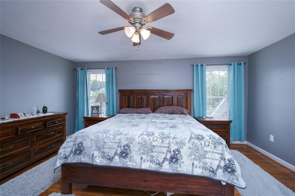 216 Locust Valley Road Greensburg, PA 15601 - Photo 27 of 32 a bedroom with a bed and a chandelier