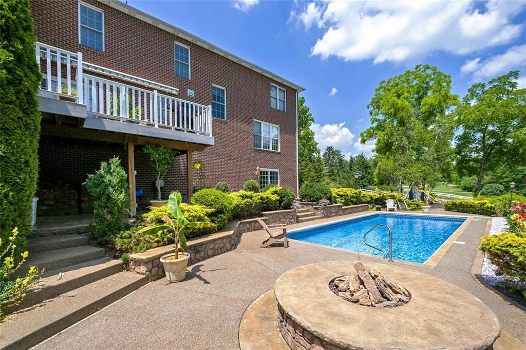 216 Locust Valley Road Greensburg, PA 15601 - Photo 6 of 32 a view of a house with swimming pool and sitting area