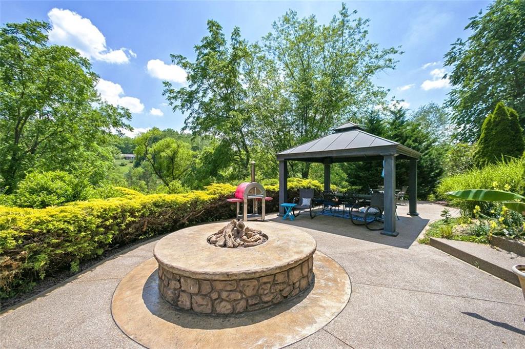 216 Locust Valley Road Greensburg, PA 15601 - Photo 7 of 32 a view of a house with backyard fountain and sitting area
