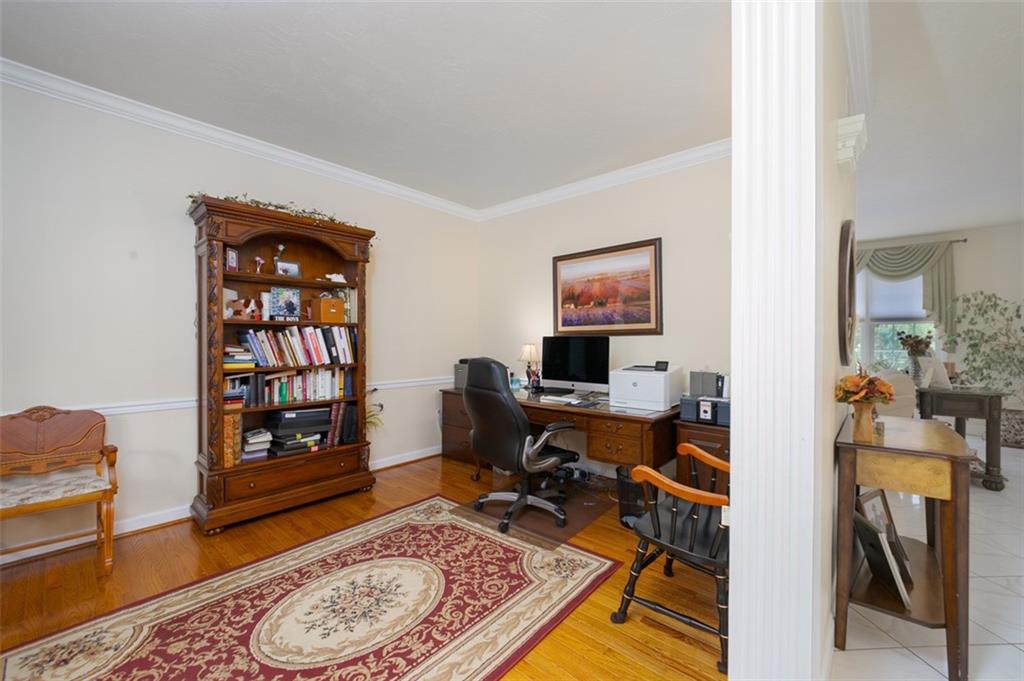216 Locust Valley Road Greensburg, PA 15601 - Photo 10 of 32 a view of a workspace with furniture and a living room