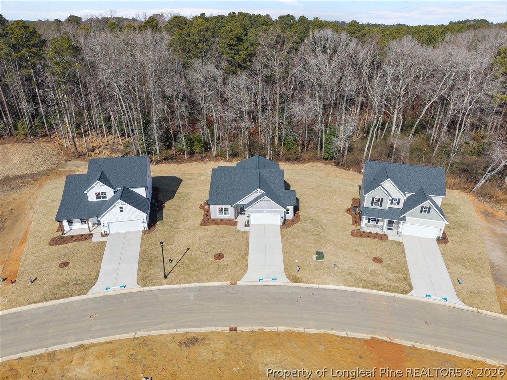 151 Michter Street Vass, NC 28394 - Photo 11 of 47 an aerial view of residential houses with outdoor space
