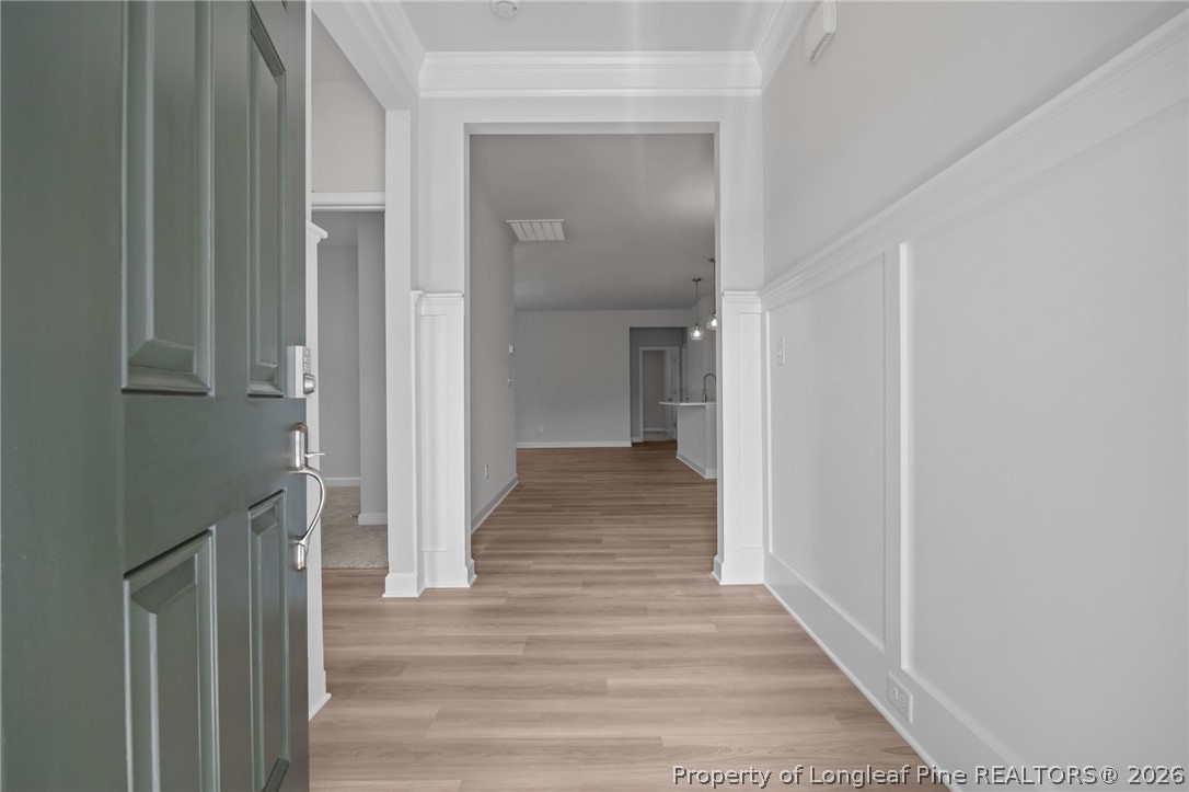 151 Michter Street Vass, NC 28394 - Photo 15 of 47 a view of a hallway with wooden floor and staircase