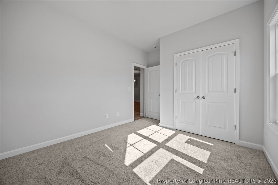 151 Michter Street Vass, NC 28394 - Photo 18 of 47 a view of an empty room and wooden floor
