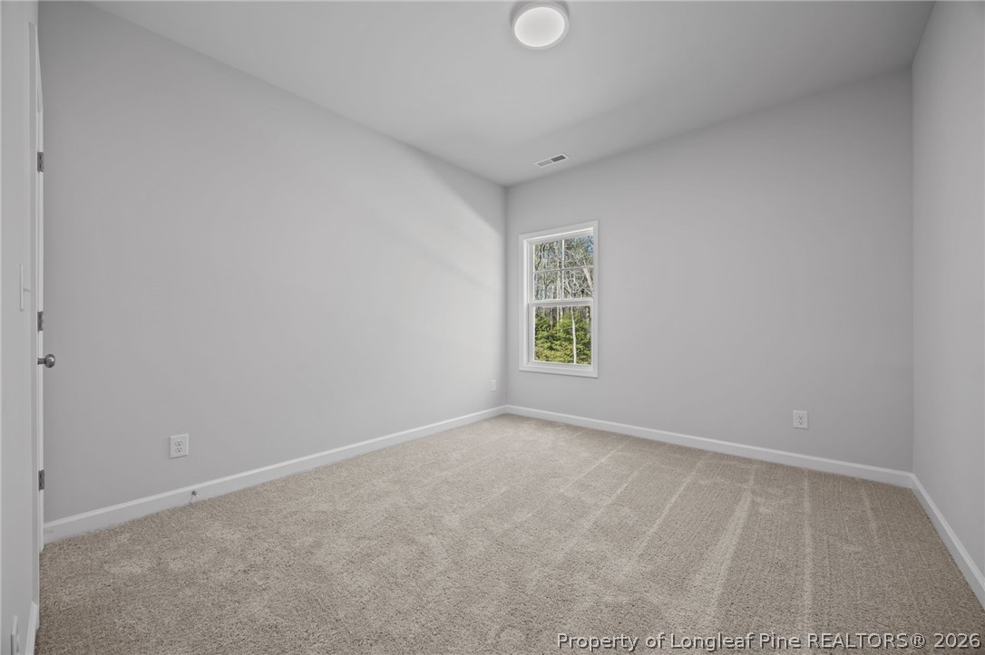 151 Michter Street Vass, NC 28394 - Photo 21 of 47 an empty room with windows