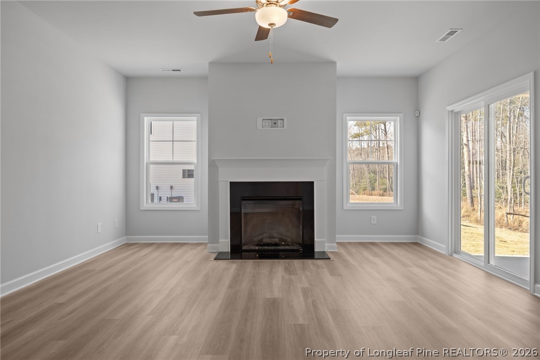 151 Michter Street Vass, NC 28394 - Photo 26 of 47 an empty room with windows and fireplace