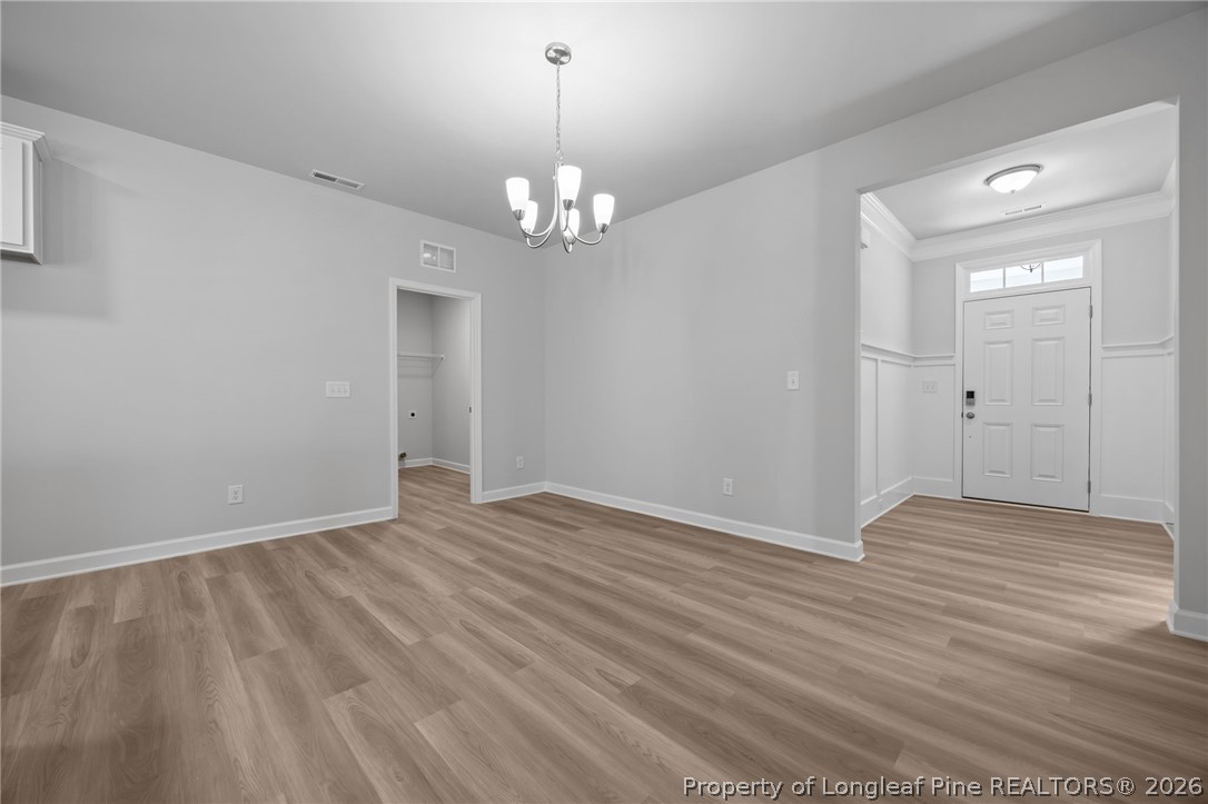 151 Michter Street Vass, NC 28394 - Photo 33 of 47 wooden floor in an empty room with a window