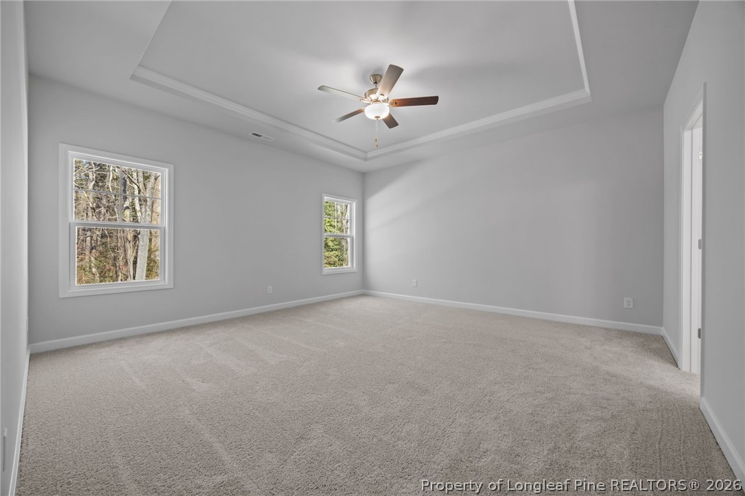 151 Michter Street Vass, NC 28394 - Photo 35 of 47 a view of a livingroom with a ceiling fan and window
