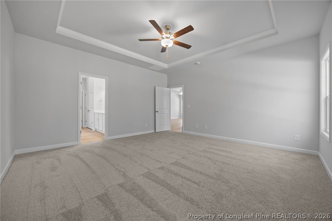 151 Michter Street Vass, NC 28394 - Photo 36 of 47 an empty room with closet and ceiling fan