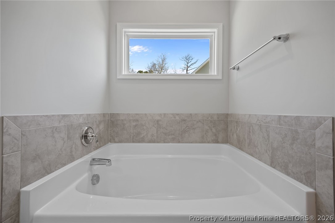 151 Michter Street Vass, NC 28394 - Photo 40 of 47 a white bath tub sitting in a bathroom