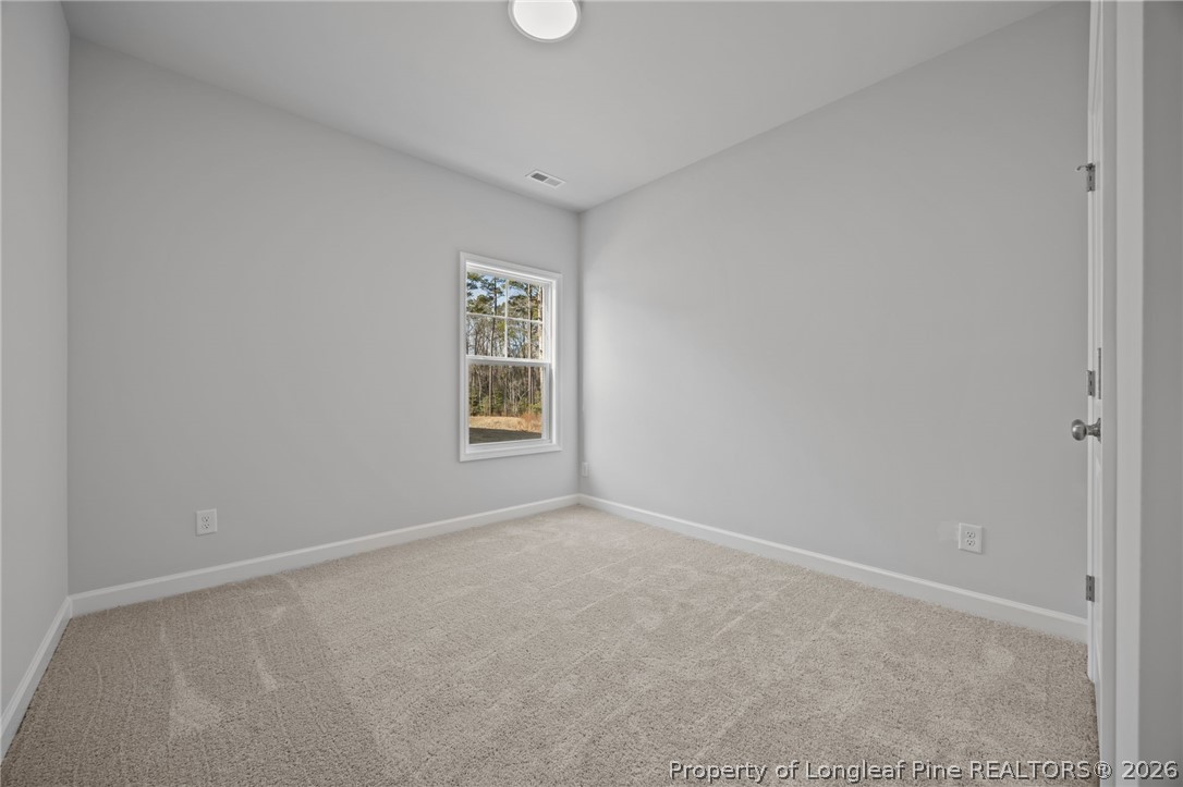 151 Michter Street Vass, NC 28394 - Photo 42 of 47 an empty room with windows