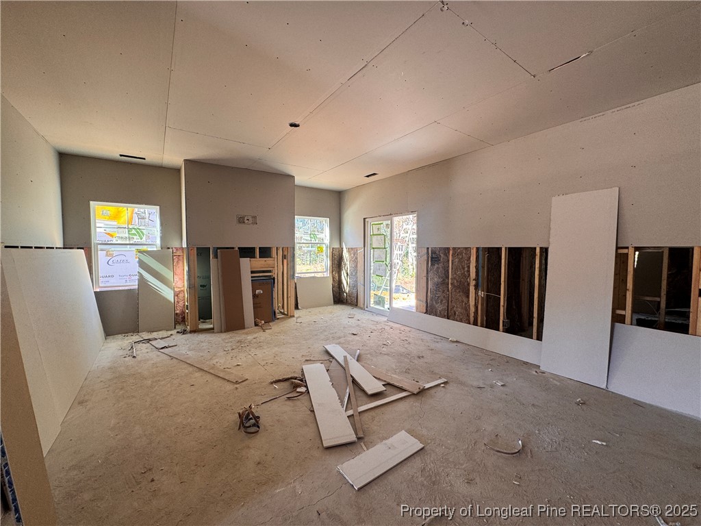 151 Michter Street Vass, NC 28394 - Photo 7 of 13 a spacious bedroom with a large bed and a dresser