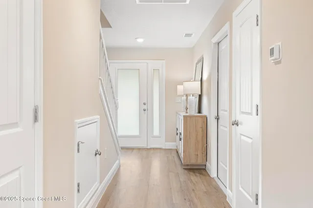 a view of room with window and wooden floor