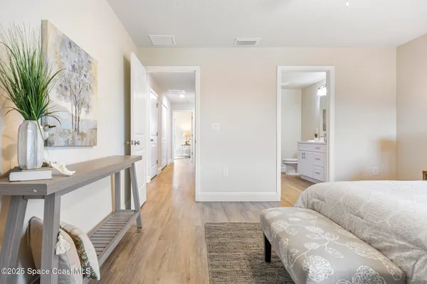 a spacious bathroom with a double vanity sink and a mirror