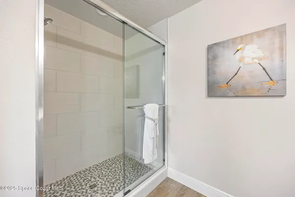 a spacious bathroom with a double vanity sink and mirror