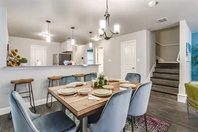 a view of a dining room and livingroom with furniture