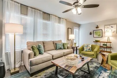 a living room with furniture and a window