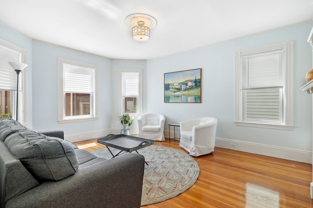 41-43 White Place Brookline, MA 02445 - Photo 2 of 14 a living room with furniture and a window