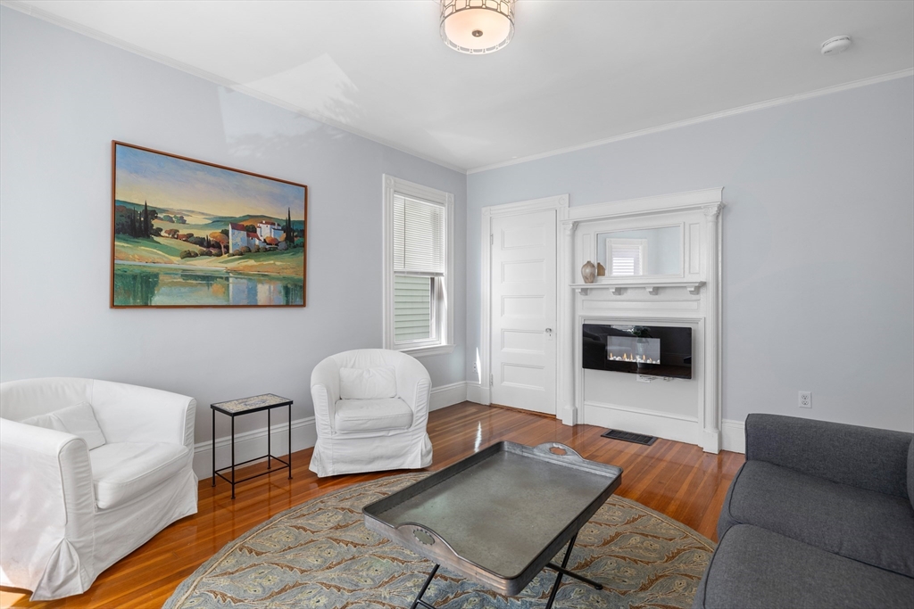 41-43 White Place Brookline, MA 02445 - Photo 3 of 14 a living room with furniture and a fireplace