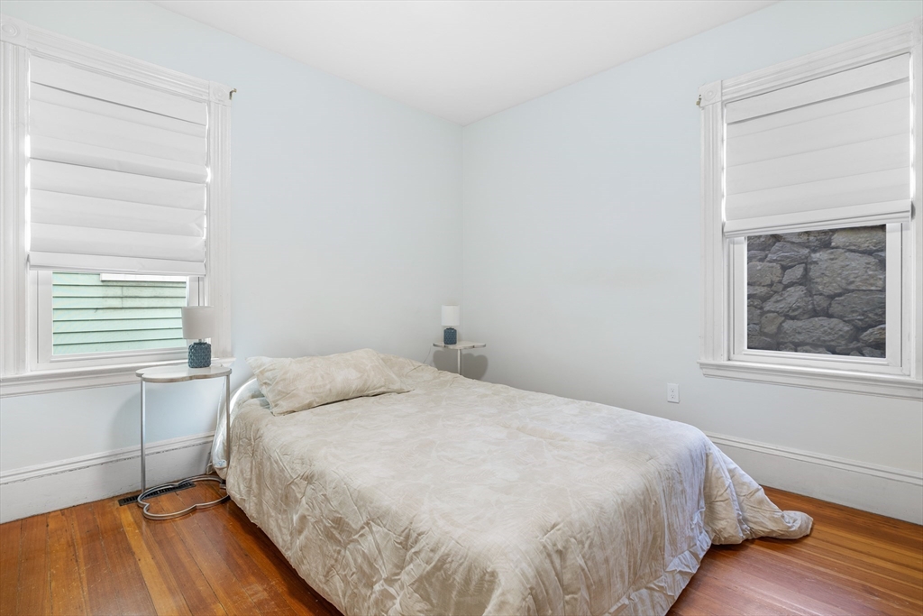 41-43 White Place Brookline, MA 02445 - Photo 6 of 14 a bedroom with a bed and a window