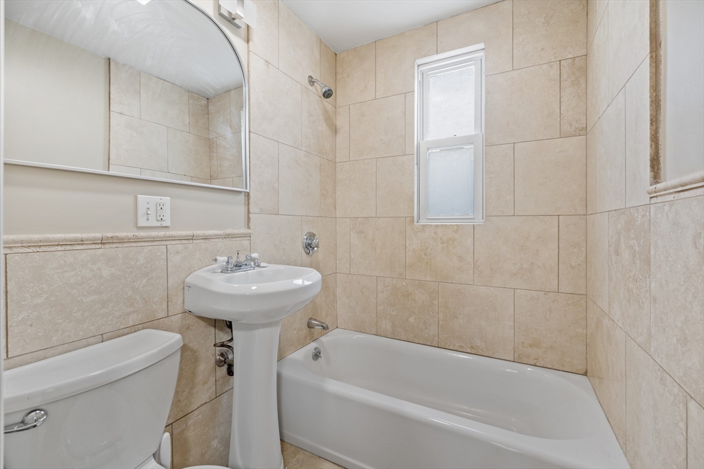 41-43 White Place Brookline, MA 02445 - Photo 7 of 14 a bathroom with a sink a toilet and bathtub
