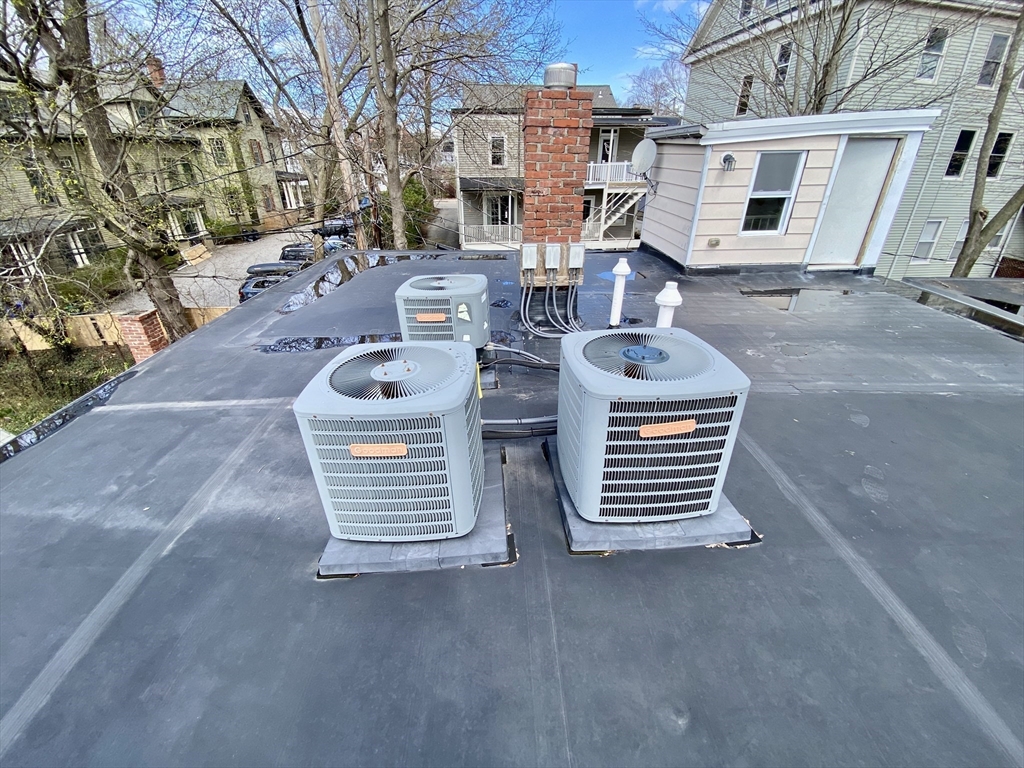 41-43 White Place Brookline, MA 02445 - Photo 9 of 14 front view of a house with barbeque and stove
