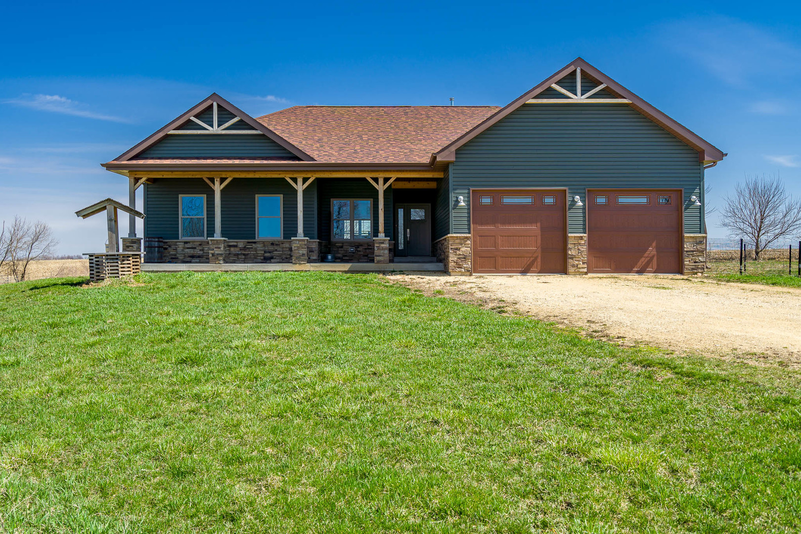 14483 Montague Road Winnebago, IL 61088 - Photo 1 of 50 a front view of a house with a yard