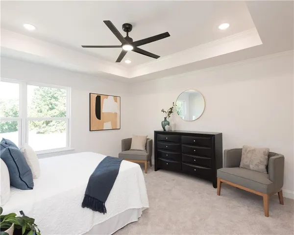 a bedroom with bed and a couch