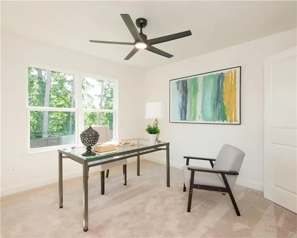 a hallway with windows and closet