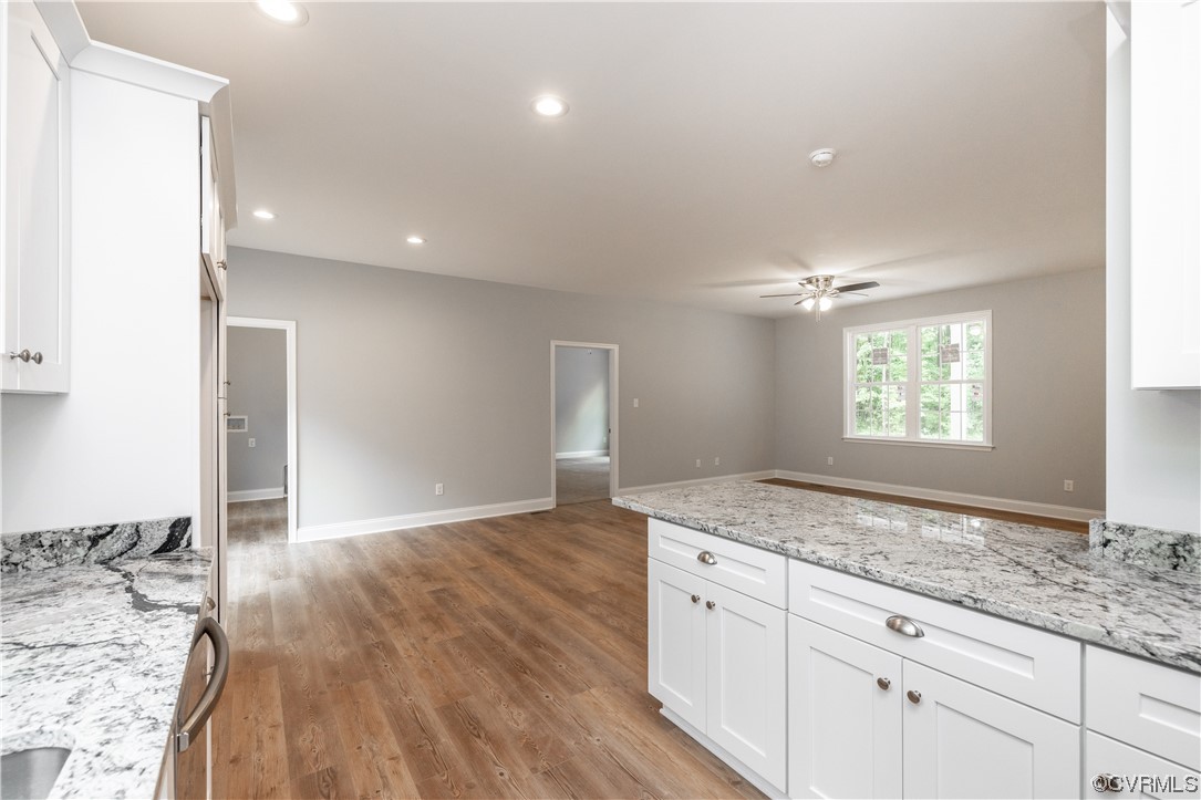 76 Trents Mill Road Cumberland, VA 23040 - Photo 11 of 36 a kitchen with granite countertop a sink and a stove top oven