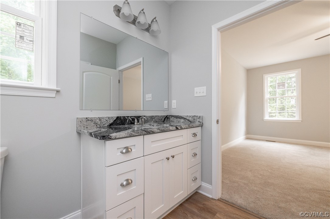 76 Trents Mill Road Cumberland, VA 23040 - Photo 18 of 36 a kitchen with a stove and cabinets