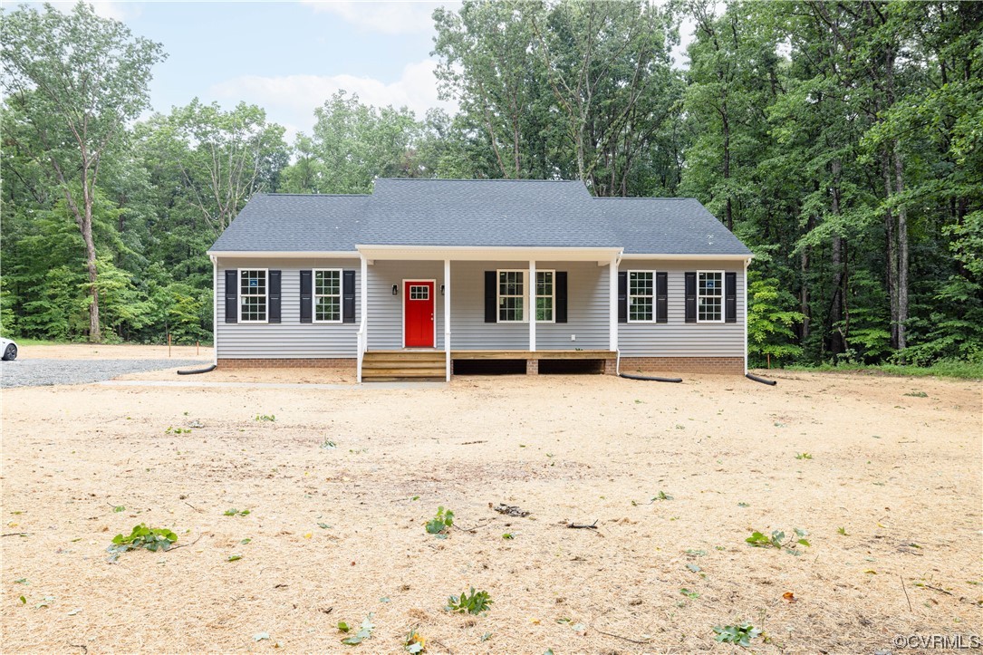 76 Trents Mill Road Cumberland, VA 23040 - Photo 2 of 36 a house with trees in the background