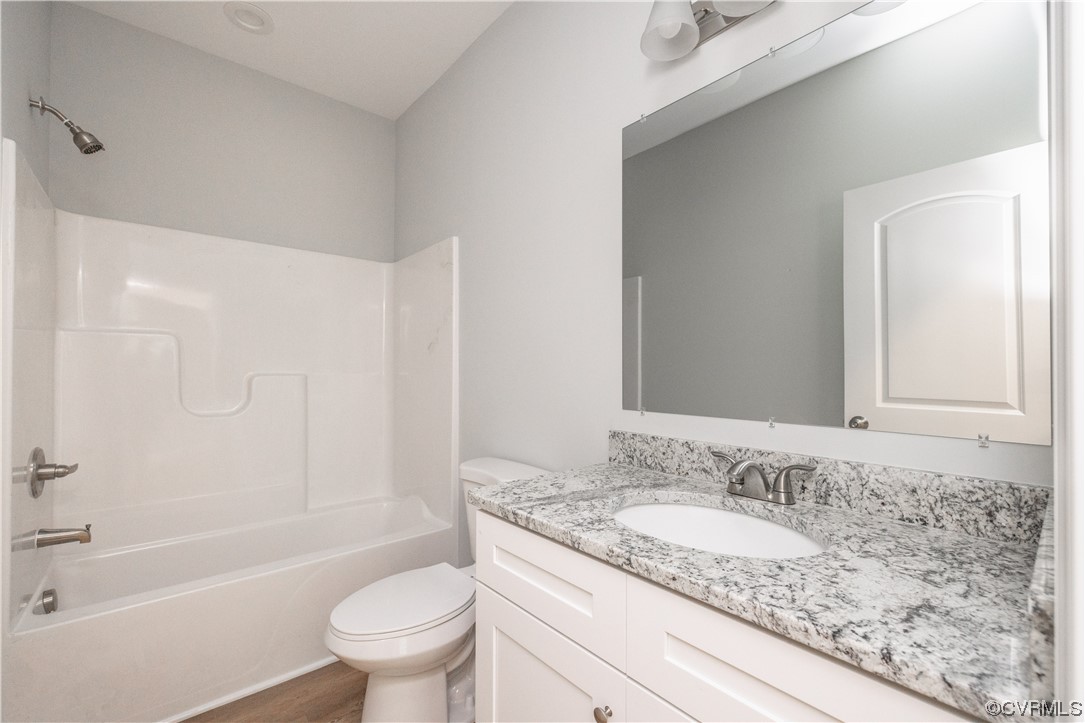 76 Trents Mill Road Cumberland, VA 23040 - Photo 21 of 36 a bathroom with a granite countertop sink a toilet and shower