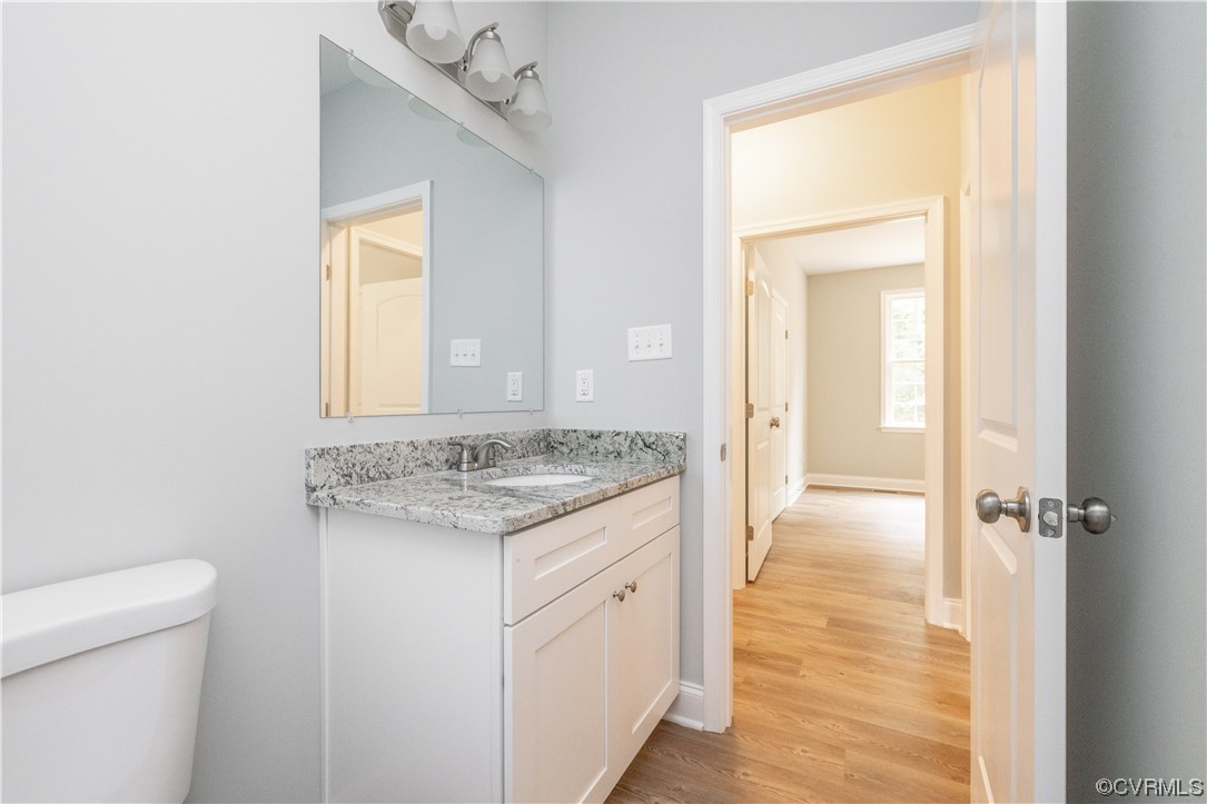76 Trents Mill Road Cumberland, VA 23040 - Photo 22 of 36 a bathroom with a granite countertop sink a toilet and a shower