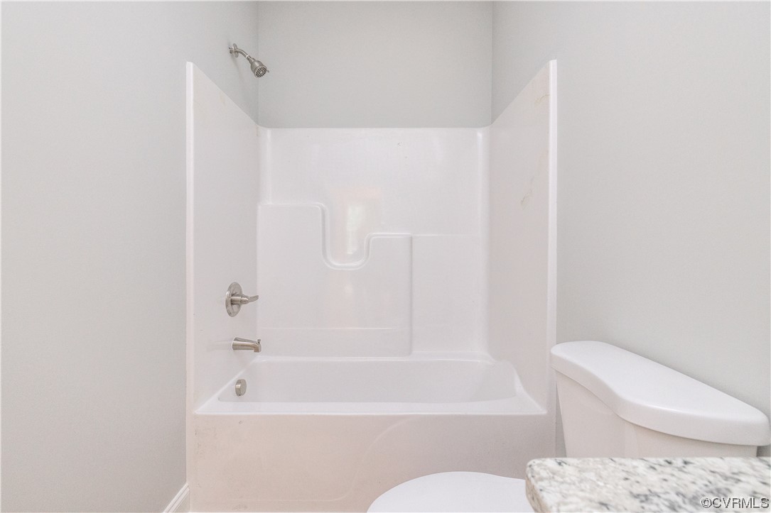 76 Trents Mill Road Cumberland, VA 23040 - Photo 23 of 36 a bathroom with a toilet and a bathtub