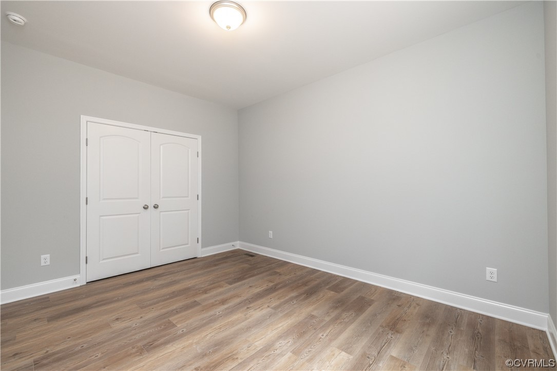 76 Trents Mill Road Cumberland, VA 23040 - Photo 25 of 36 a view of an empty room with wooden floor