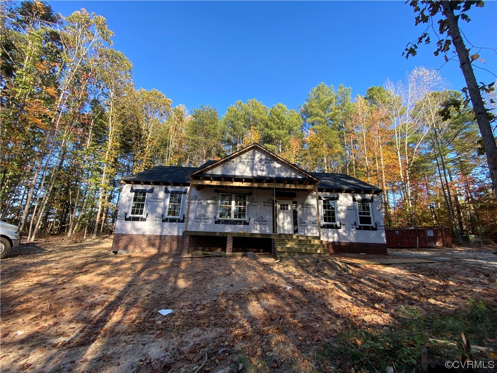 76 Trents Mill Road Cumberland, VA 23040 - Photo 31 of 36 a front view of a house with a yard