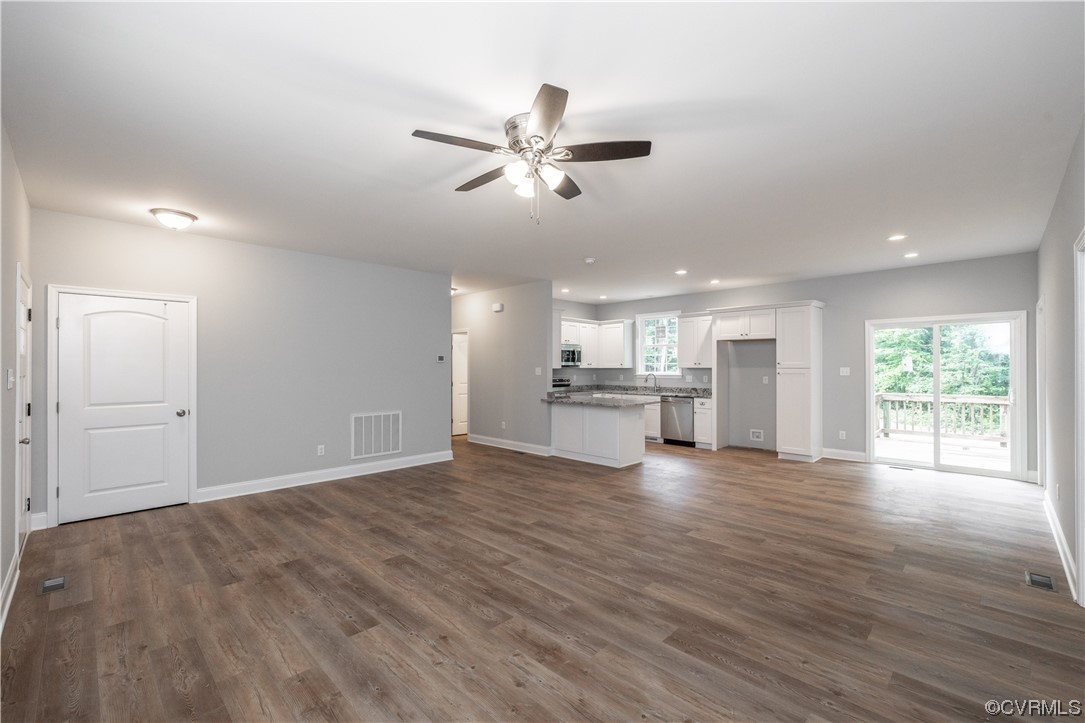 76 Trents Mill Road Cumberland, VA 23040 - Photo 5 of 36 a view of an empty room with wooden floor and a window