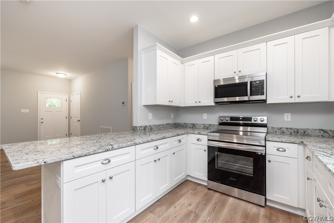 76 Trents Mill Road Cumberland, VA 23040 - Photo 10 of 36 a kitchen with stainless steel appliances granite countertop a stove and a sink