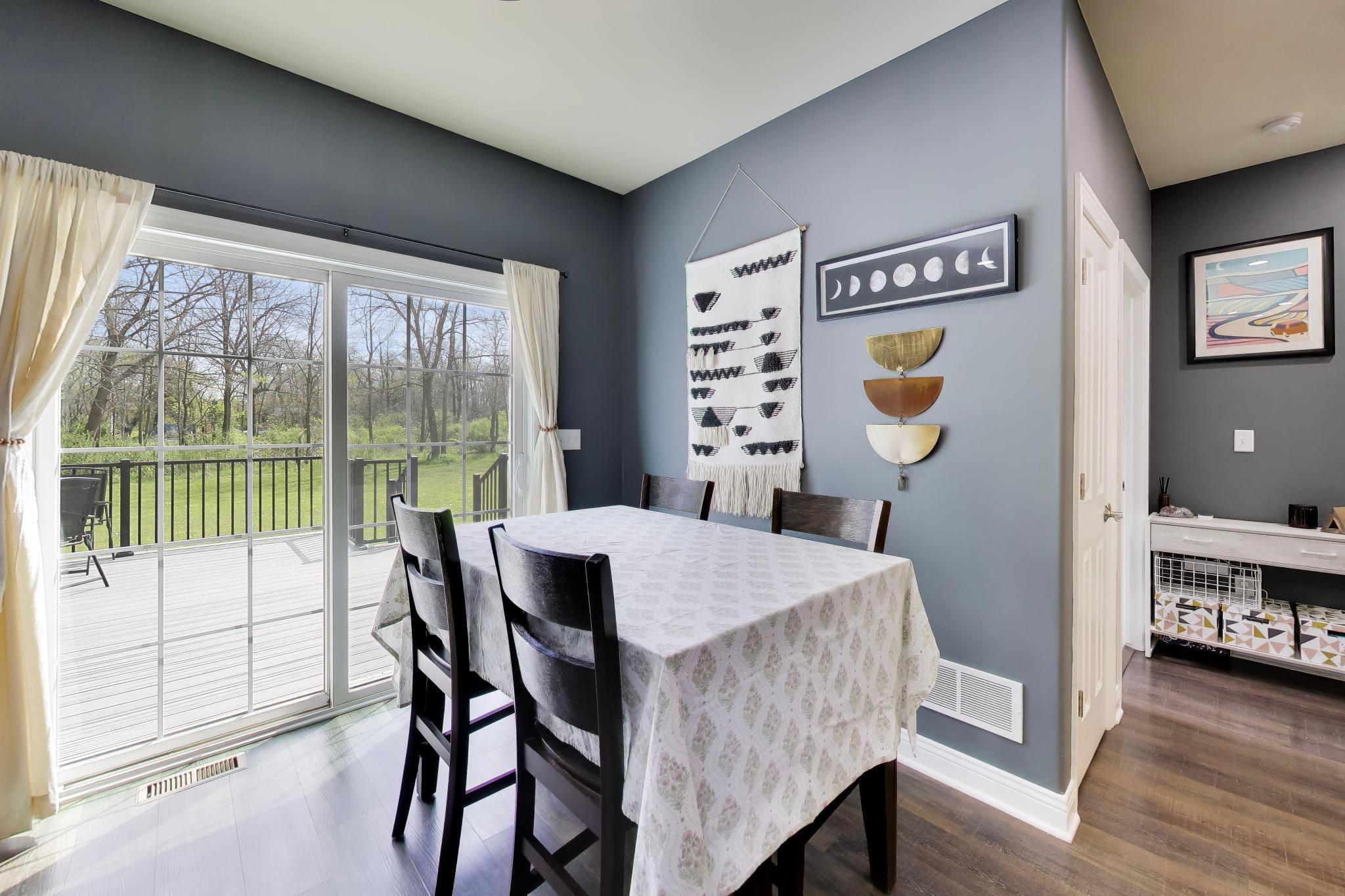 N2392 Mildred Street Delavan, WI 53115 - Photo 13 of 41 Dining space featuring a sliding glass door leading to the 272 sq ft Trex deck and backyard.