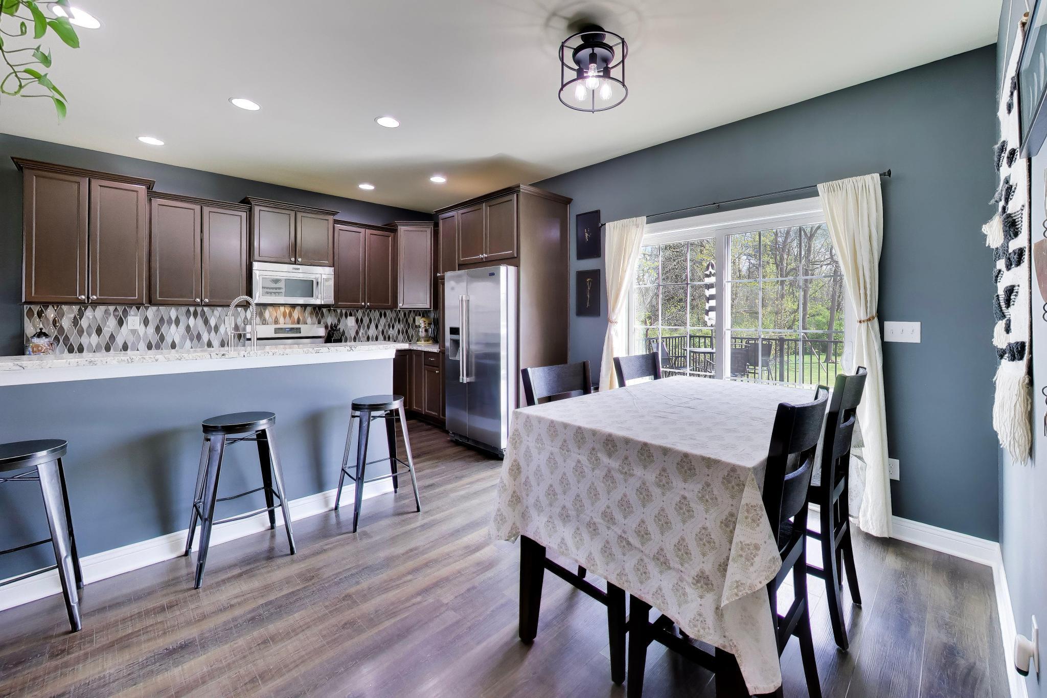 N2392 Mildred Street Delavan, WI 53115 - Photo 14 of 41 Dining area with extra bar seating in open kitchen